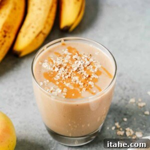 cup of apple smoothie with oats sprinkled on top