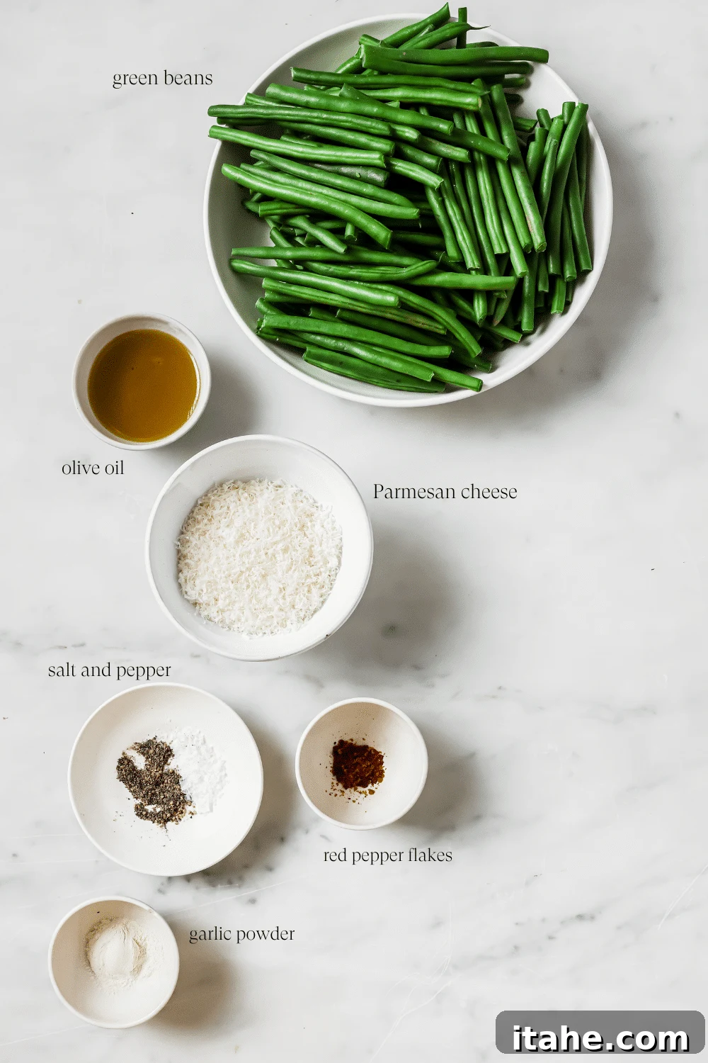 Pre-measured ingredients for parmesan green beans arranged on a counter.