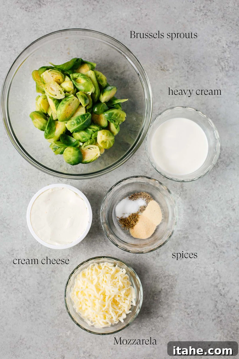 Creamy Brussels Sprouts Gratin 3 Close-up image of the main ingredients: Brussels sprouts, cream cheese, half-and-half, seasonings, and mozzarella.