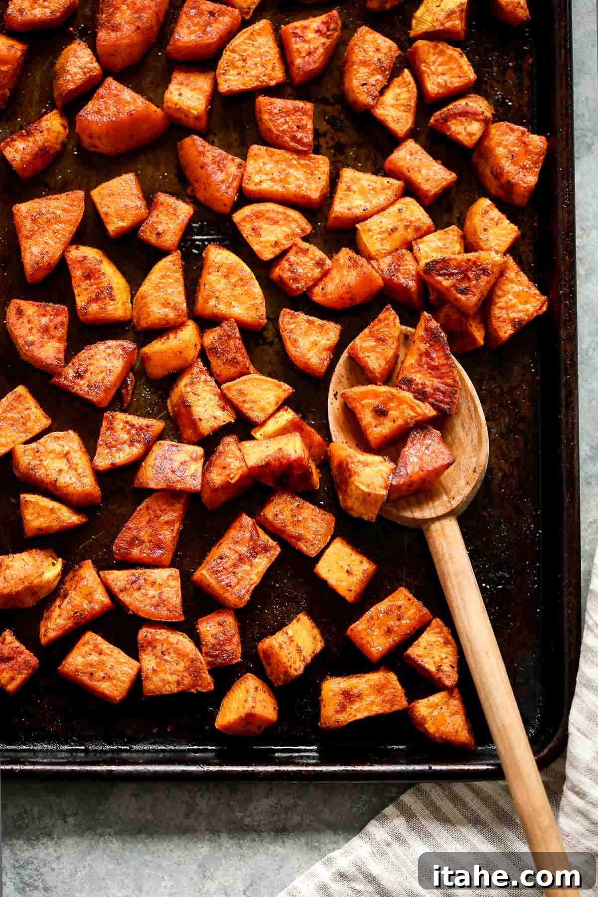 Caramelized Sweet Potato Delight 2 perfectly roasted sweet potato on a baking tray, golden brown and garnished