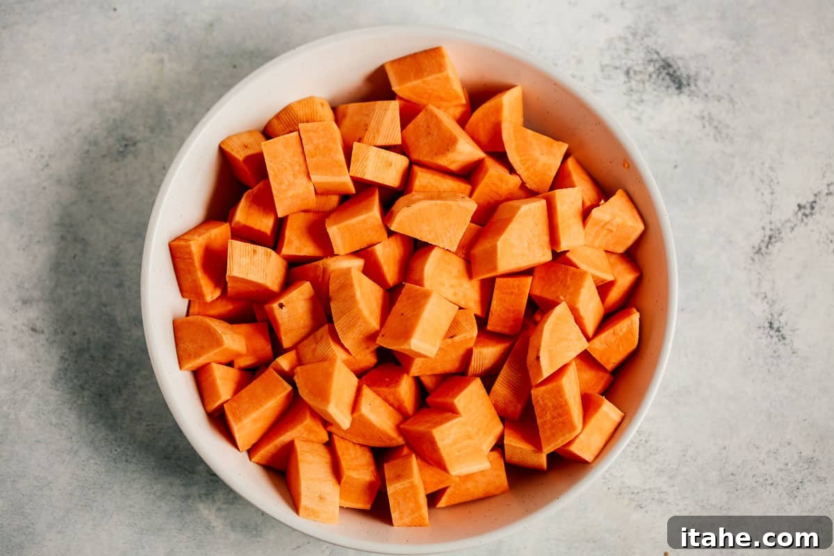Caramelized Sweet Potato Delight 7 bowl of raw chopped sweet potato cubes, perfectly prepped for roasting
