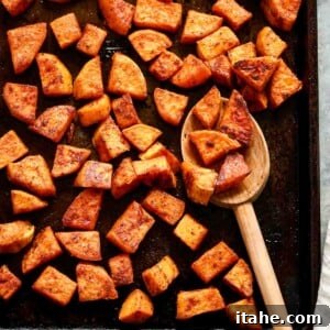 Caramelized Sweet Potato Delight 8 close up of roasted sweet potato cubes with fresh parsley garnish