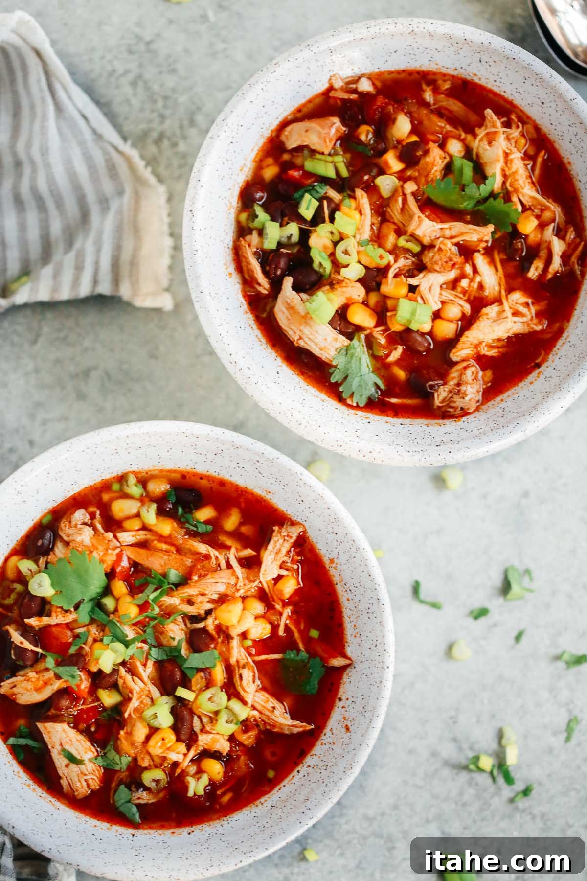 Instant Pot Fiesta Chicken Soup 6 Two enticing bowls of Instant Pot Southwest Chicken Soup, beautifully garnished and ready to be enjoyed, highlighting the vibrant colors and textures.
