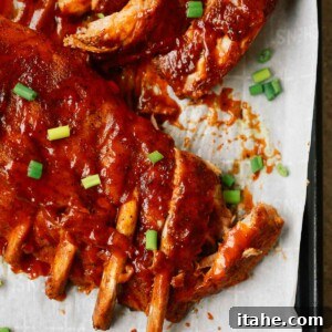 A close up of ribs on a baking sheet