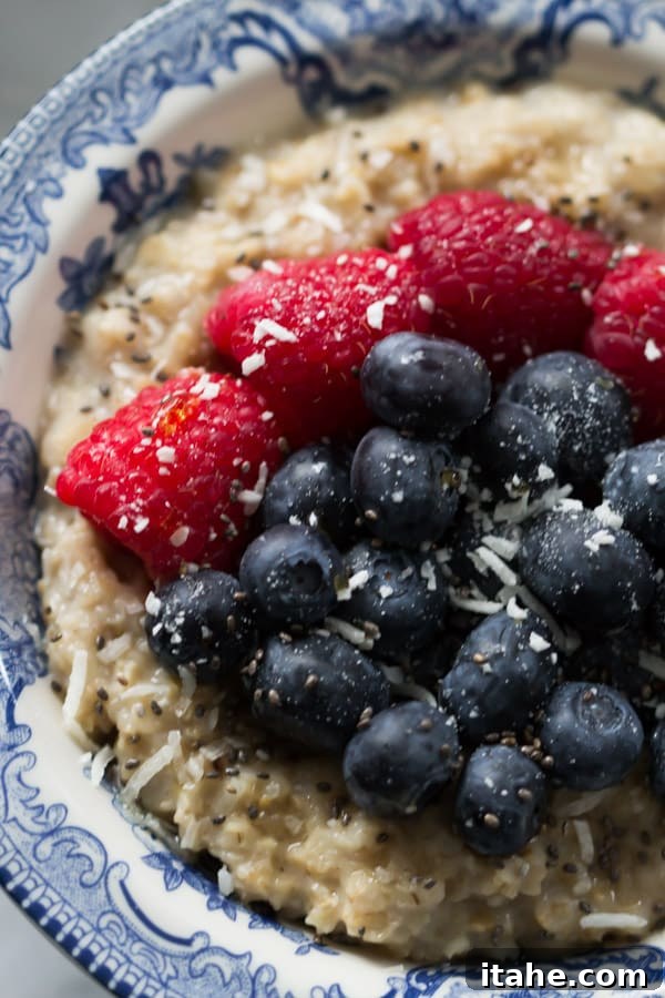 Overhead shot of Coconut Berries Oatmeal, perfectly arranged with vibrant berries and coconut flakes.