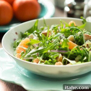 Clementine Arugula Salad ingredients beautifully arranged.
