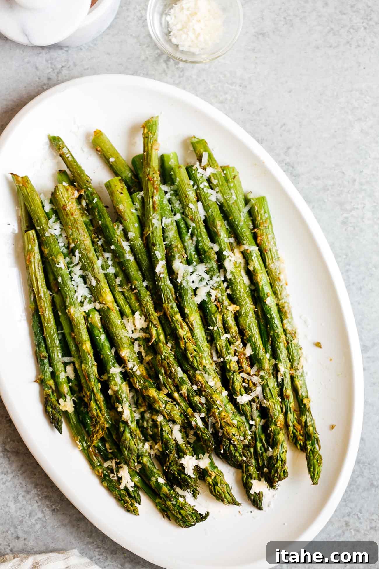 Overhead view of perfectly crispy Air Fryer Asparagus ready to serve