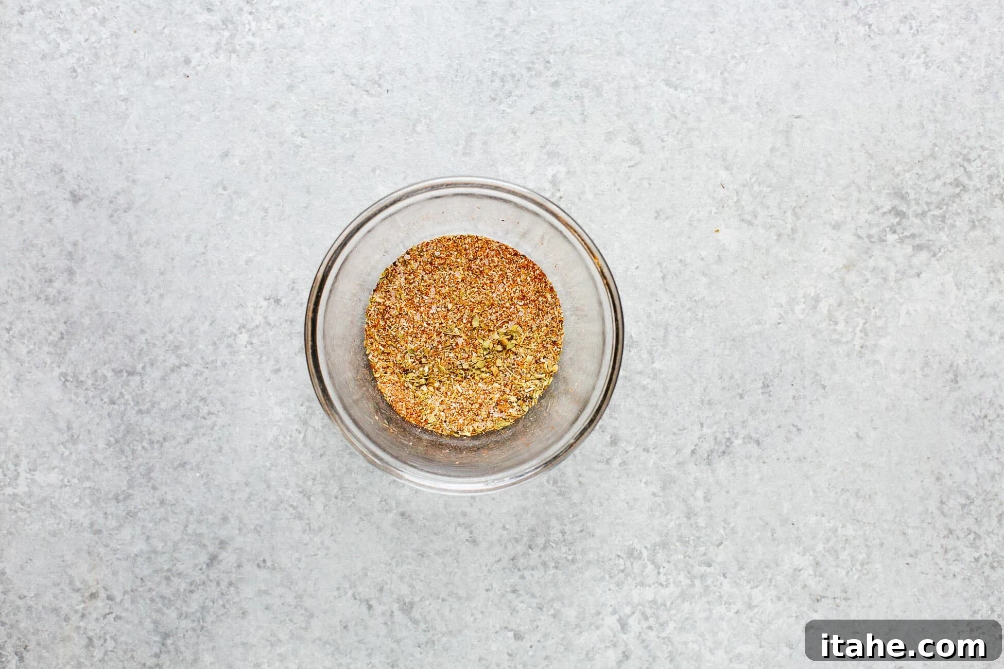 overhead view of glass bowl containing dried spices