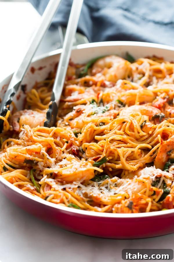 Delicious One-Pan Shrimp Spaghetti with vibrant tomato sauce and fresh spinach