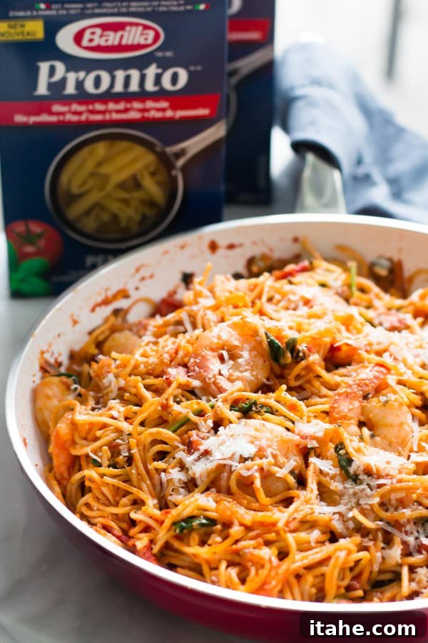 One-Pan Shrimp Pasta with red sauce, fresh parsley, and parmesan