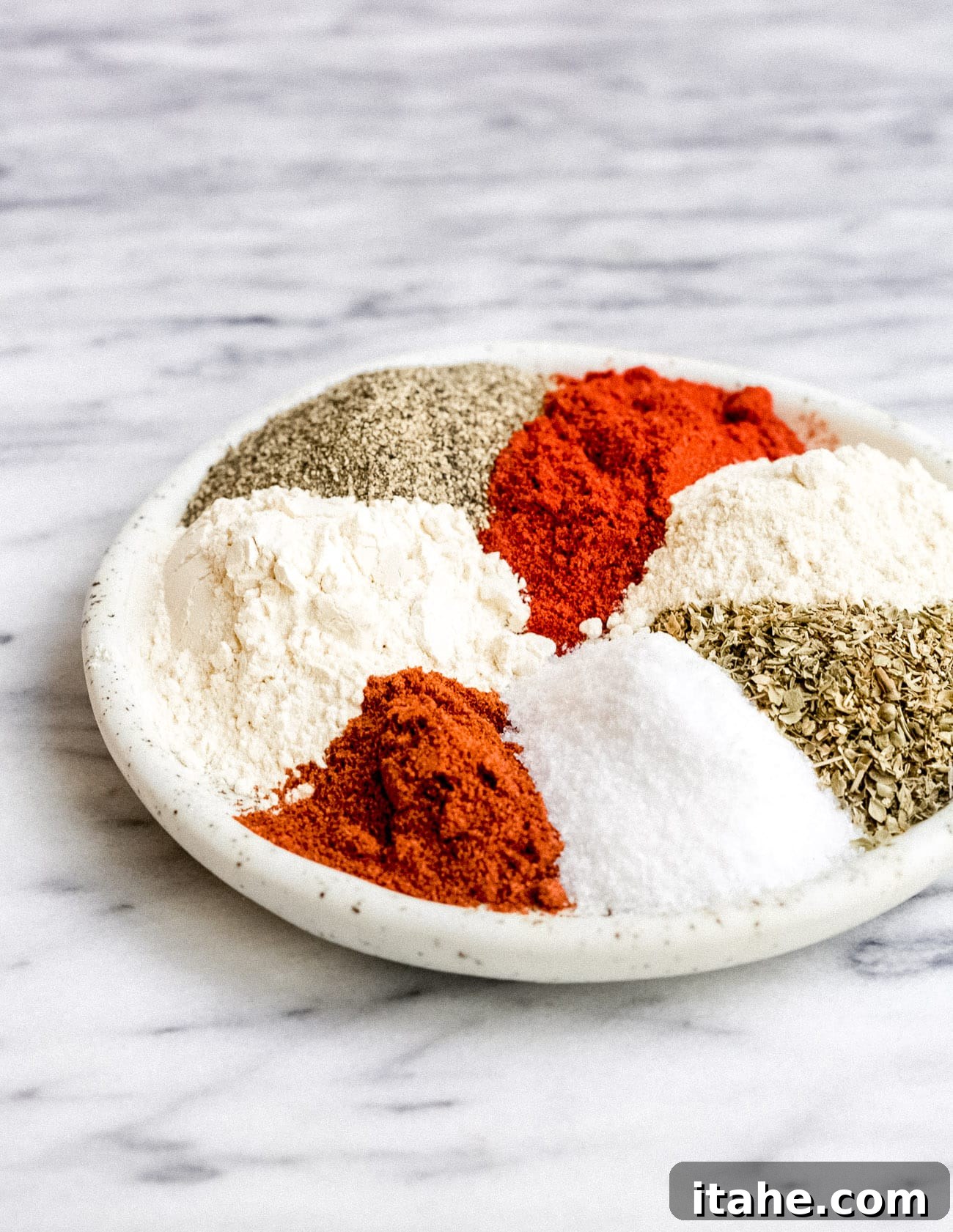 Craft Your Own Cajun Spice Blend 3 A bowl filled with freshly mixed homemade Cajun seasoning, ready to be used in various culinary creations.