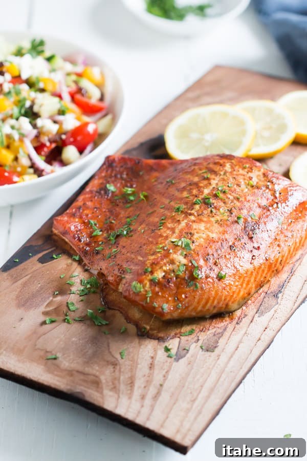 Close-up of flaky Cedar Plank Salmon with herbs and lemon