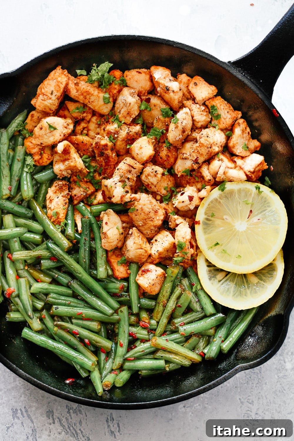 A close-up shot of a Spicy Green Beans Chicken Skillet, a vibrant and flavorful meal.