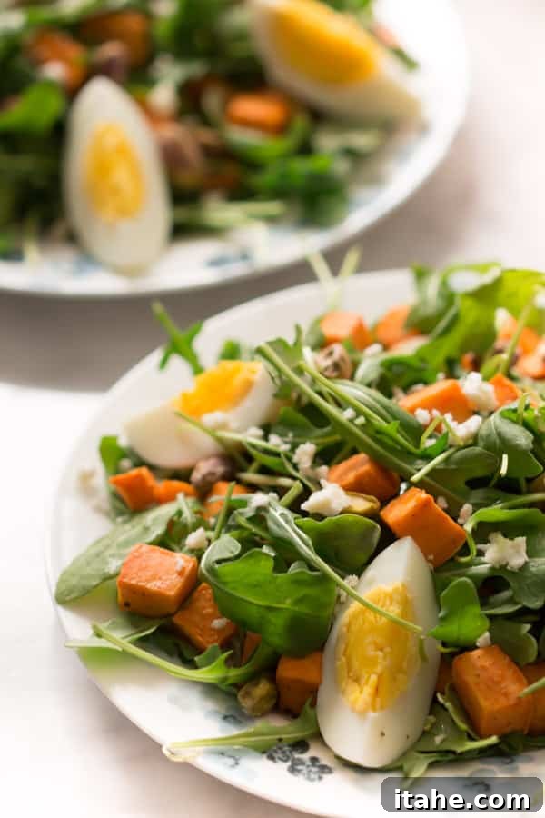 sweet-potato-arugula-salad - This Sweet Potato Arugula Salad is packed with pistachios, sweet potato, feta cheese and a delicious honey Dijon vinaigrette that pairs deliciously with arugula. sweet-potato-arugula-salad - This Sweet Potato Arugula Salad is packed with pistachios, sweet potato, feta cheese and a delicious honey Dijon vinaigrette that pairs deliciously with arugula.