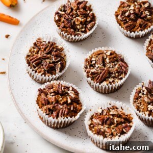 Spiced Gluten-Free Carrot Muffins 7 Gluten-free carrot muffins in a muffin tin