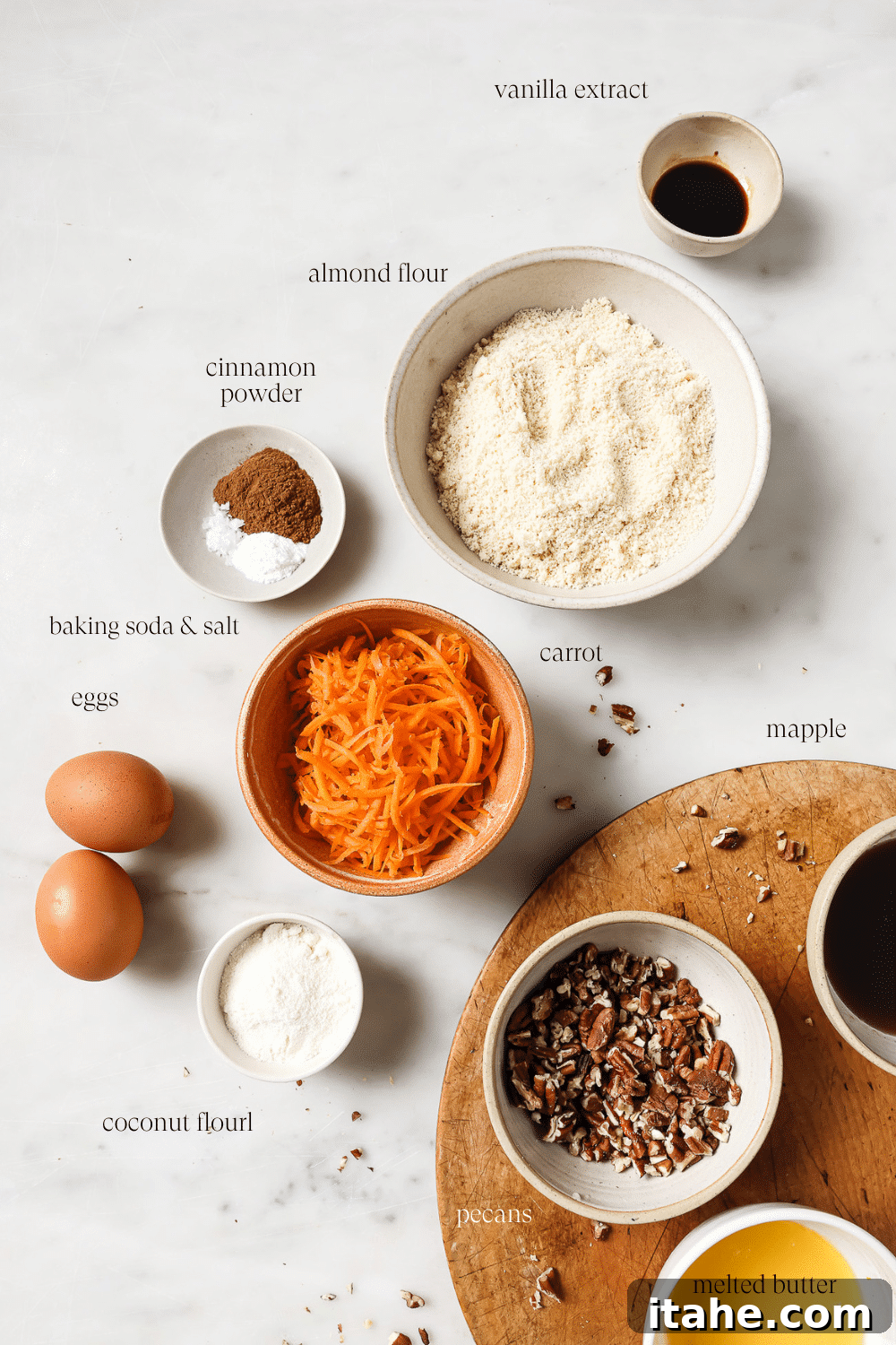 Spiced Gluten-Free Carrot Muffins 3 Bowls of pre-measured ingredients on a white countertop.