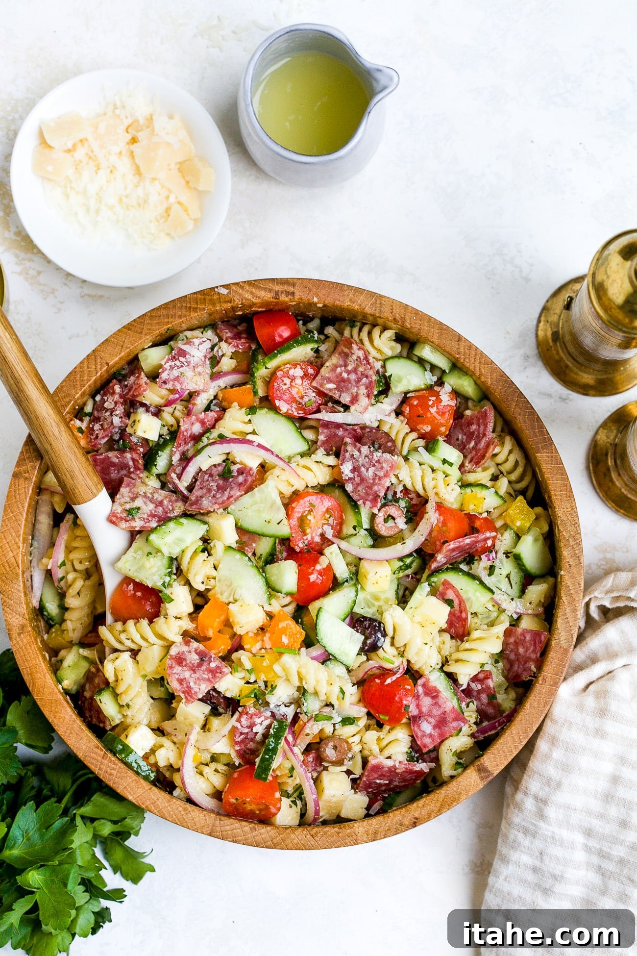 Vibrant Italian Pasta Salad 7 Overhead view of Italian Pasta Salad Recipe in a large wooden bowl.
