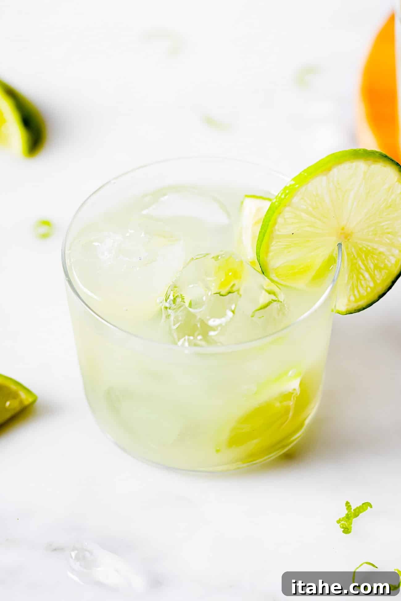 Caipirinha A Brazilian Classic 2 A vibrant glass of Caipirinha (Brazilian Drink) garnished with a fresh lime wedge, ready to be enjoyed.