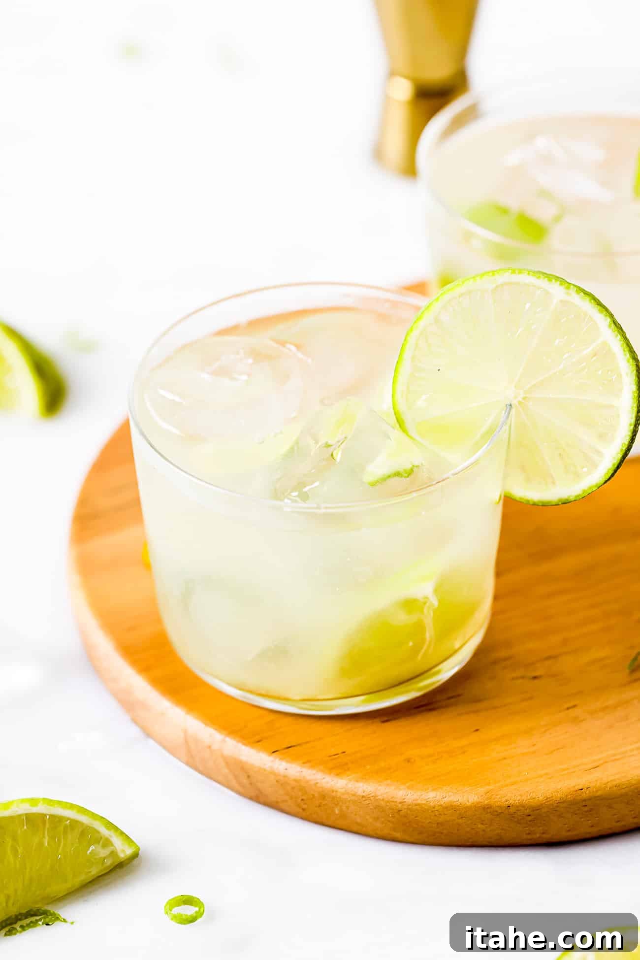 Caipirinha A Brazilian Classic 5 A close-up view of a beautifully prepared Caipirinha, showcasing its vibrant color and lime garnish.