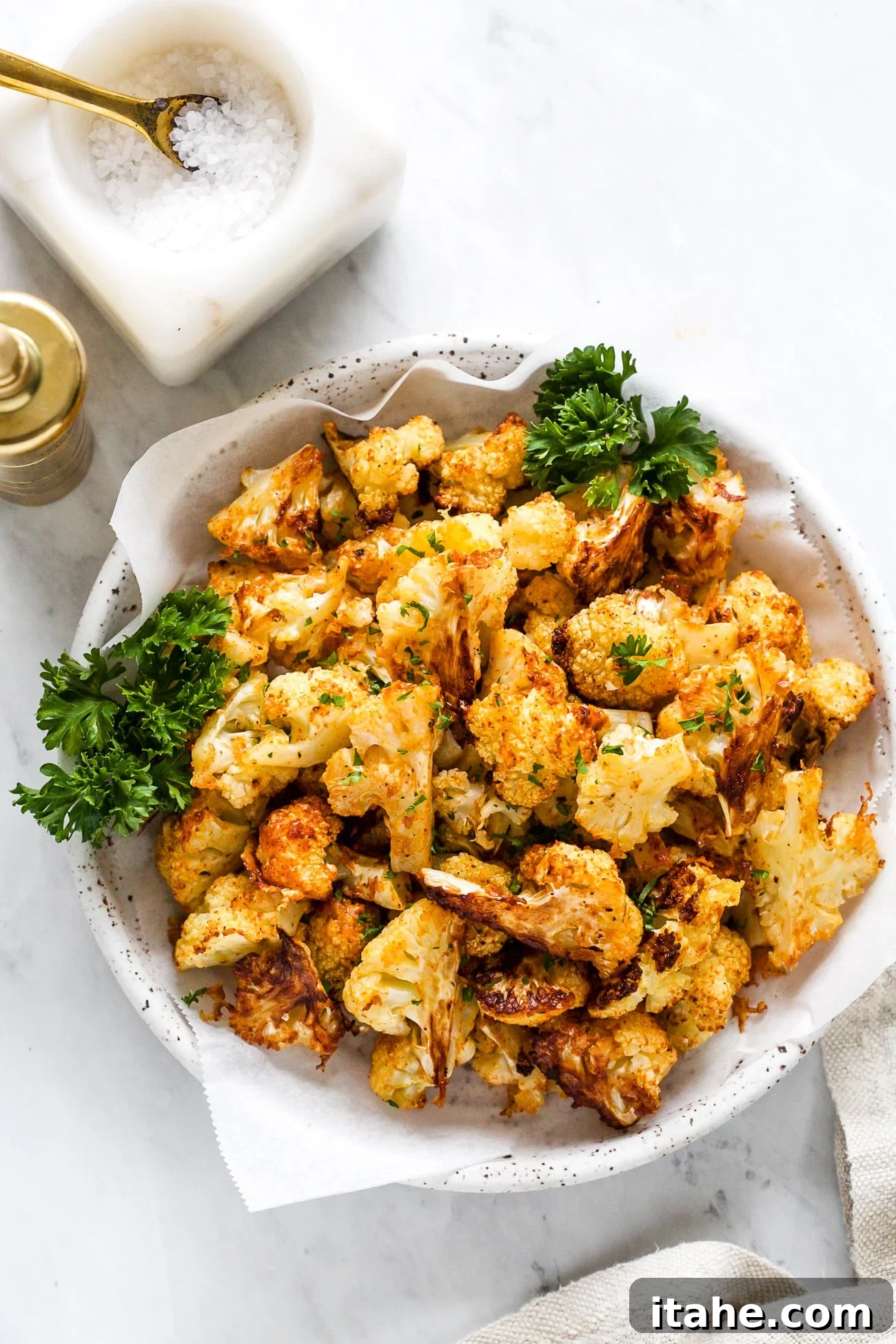 Crispy Cauliflower Poppers 2 Overhead view of crispy, golden cauliflower bites served on a plate, ready to eat.