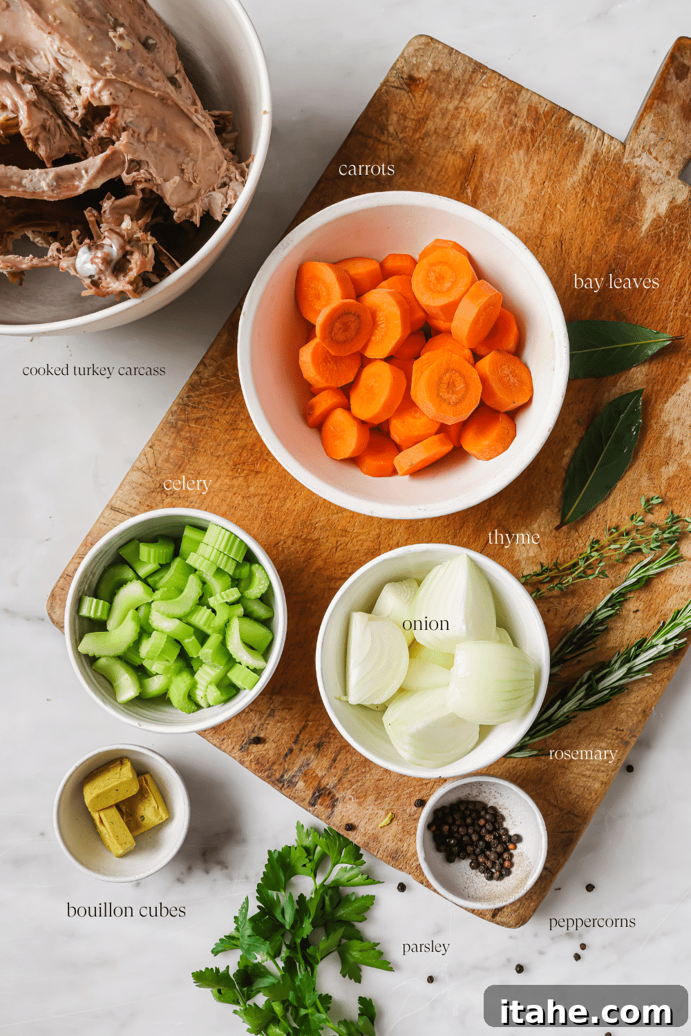 Pre-measured turkey broth ingredients on a cutting board.