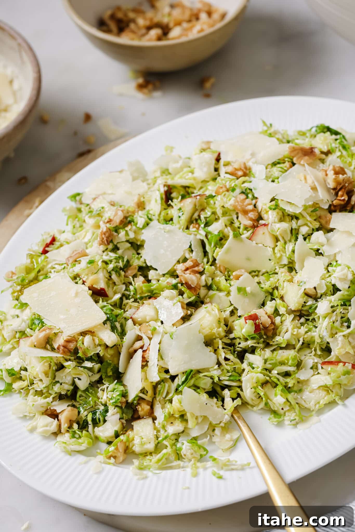 Shaved Brussels Sprouts Salad in an airtight container for storage.