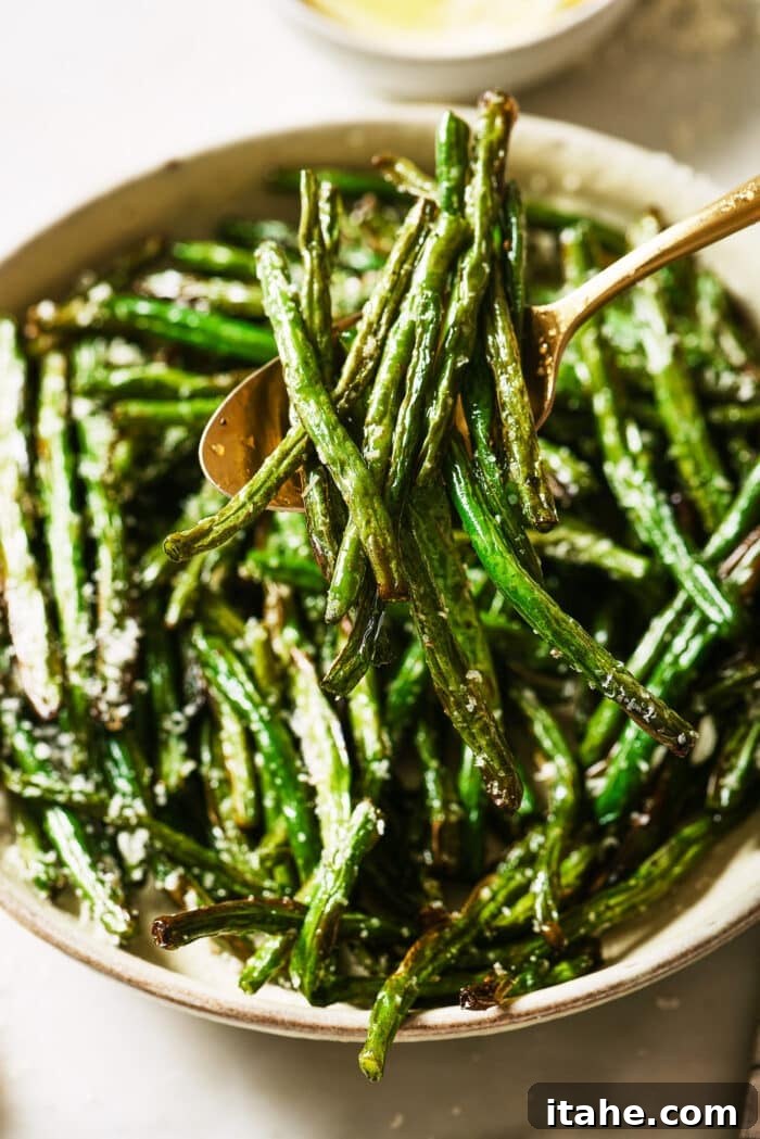 Perfectly Crispy Air Fryer Green Beans 7 Close up of air fryer green beans in a serving bowl, ready for final toppings.
