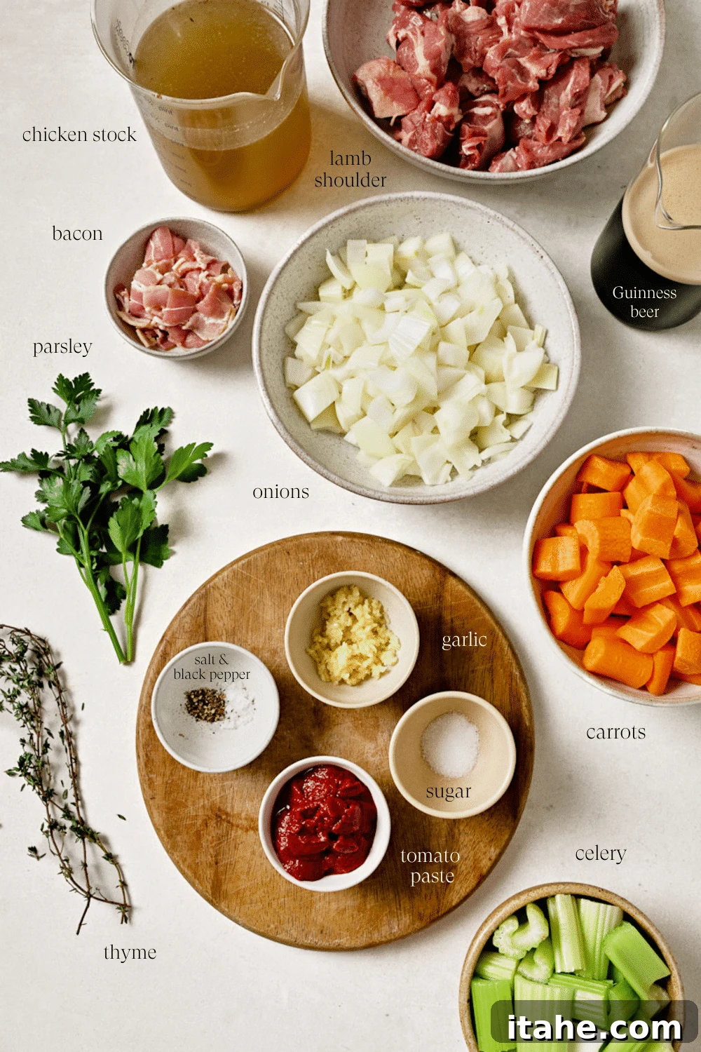 Hearty Lamb Stew 3 Pre-measured ingredients in small bowls on a white countertop.