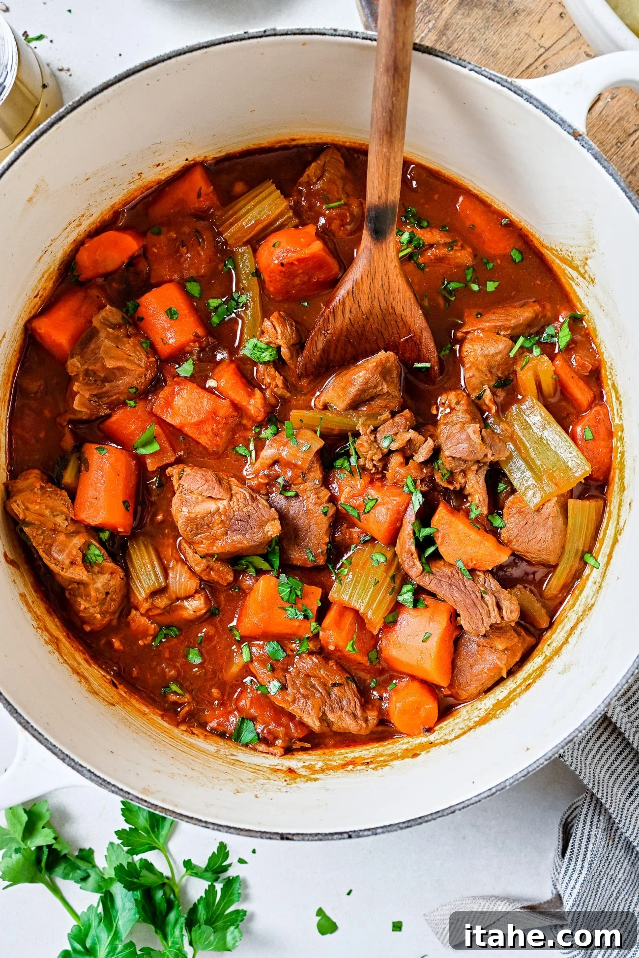 Hearty Lamb Stew 6 Lamb stew in a white Dutch oven.