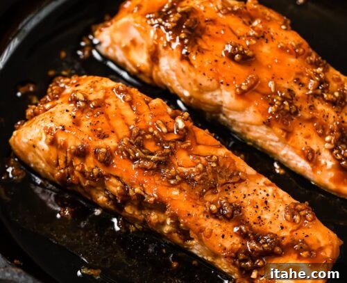 honey garlic salmon in a cast iron skillet