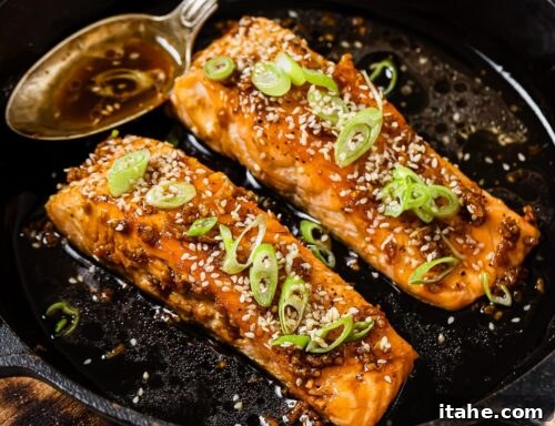 honey garlic salmon in a cast iron skillet