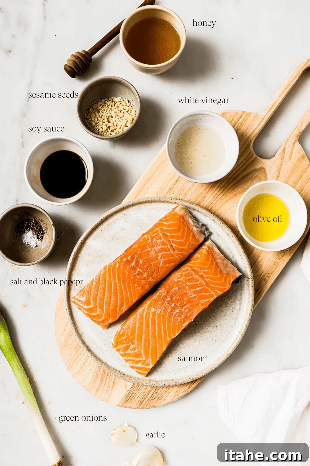 Garlic Honey Glazed Salmon 3 An overhead view of prepped ingredients on a white countertop.