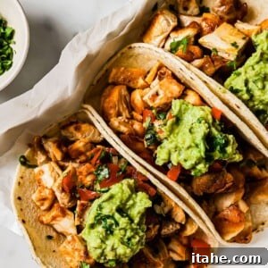 A close-up shot of the savory diced chicken taco filling in a square dish, ready for assembly.