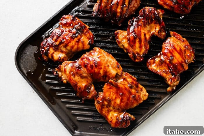 Cooking teriyaki chicken on a grill pan.