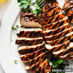 Grilled balsamic chicken on a plate.