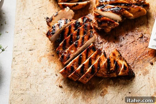 Sweet and Tangy Balsamic Chicken 15 Grilled chicken breast on a wooden board.