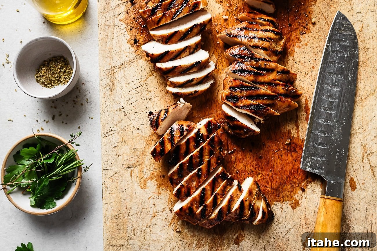 Sweet and Tangy Balsamic Chicken 8 A full view of a grilled chicken breast on a wooden board, ready to be sliced.