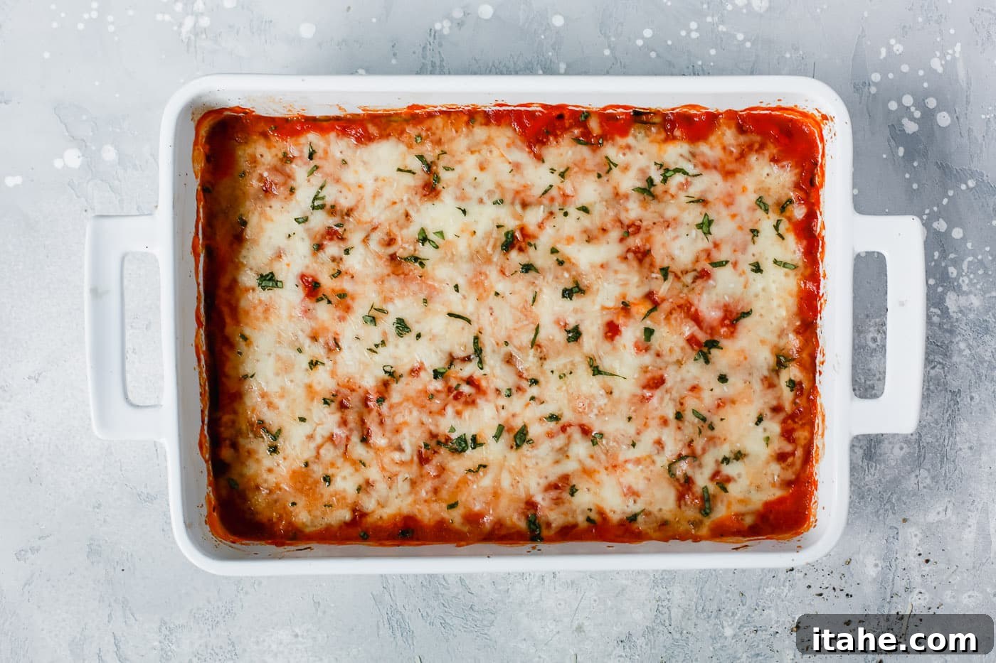 Noodle-Free Zucchini Lasagna 9 Overhead view of the freshly baked Zucchini Lasagna, golden and bubbling in the casserole dish.