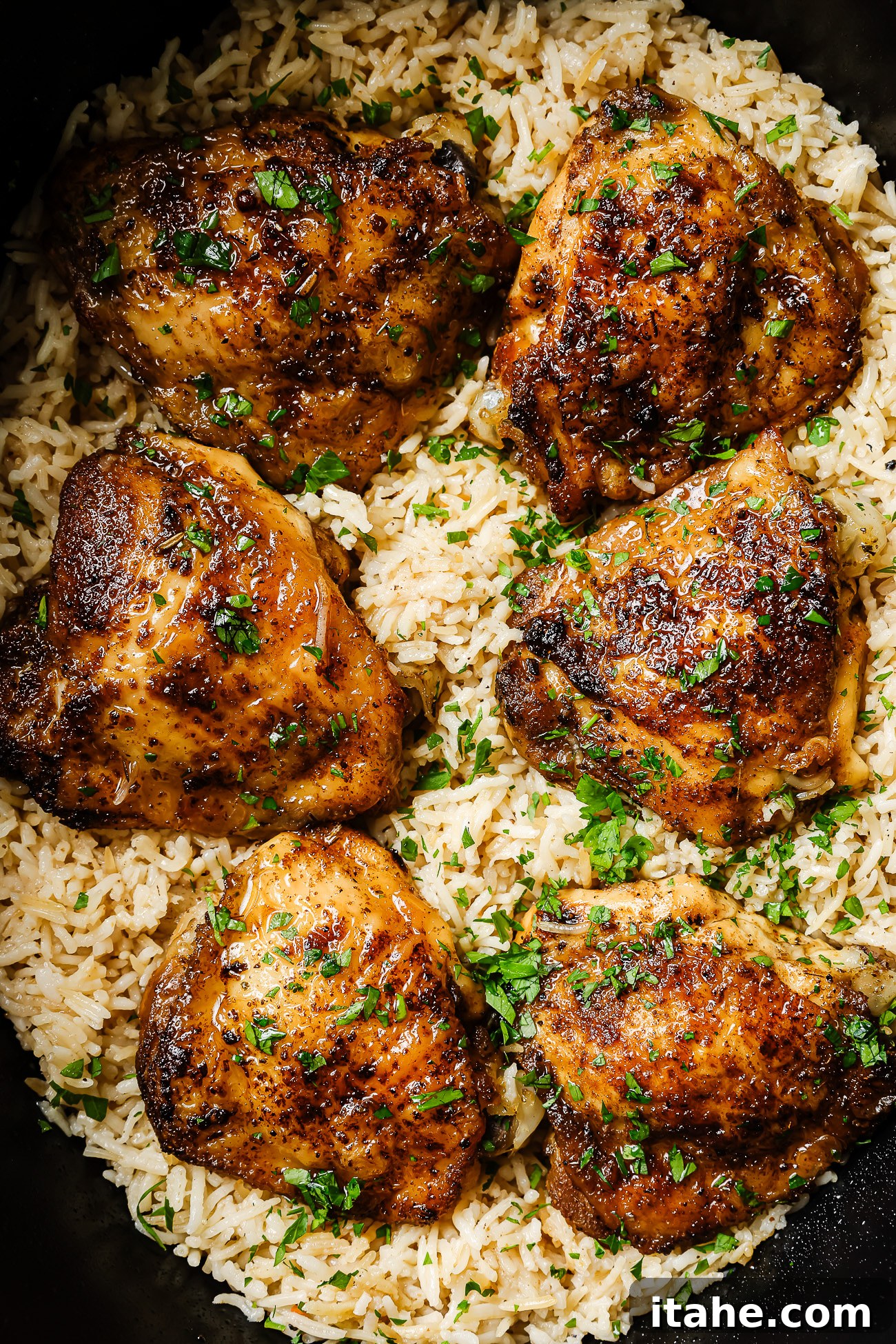 Closeup of perfectly cooked chicken and rice inside of a slow cooker bowl, ready to be served.
