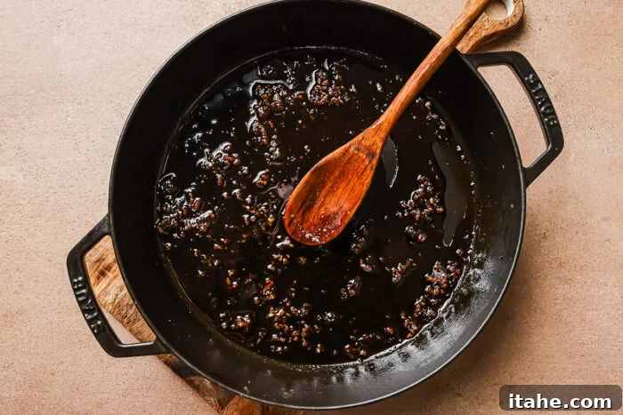 Sticky Honey Garlic Meatballs with Soy Glaze 6 honey and garlic in a cast iron skillet